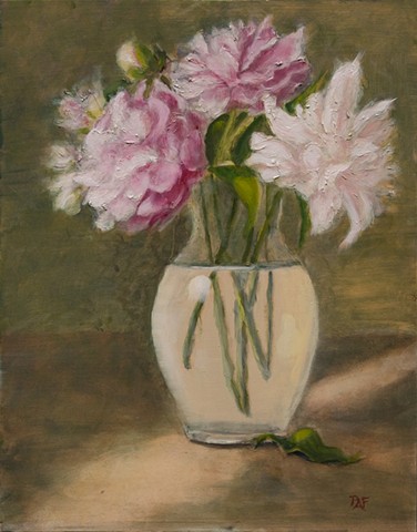 Pink and white peony's in glass vase