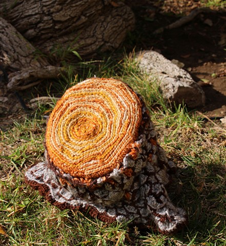 Stump log toilet paper cozy crochet tp cozy yarn fiber art by Pat Ahern.