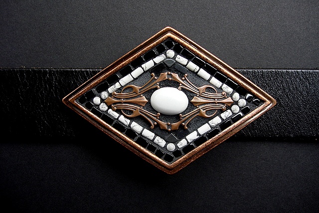 One of a kind belt buckle with magnesite, copper, onyx,howlite and hematite.