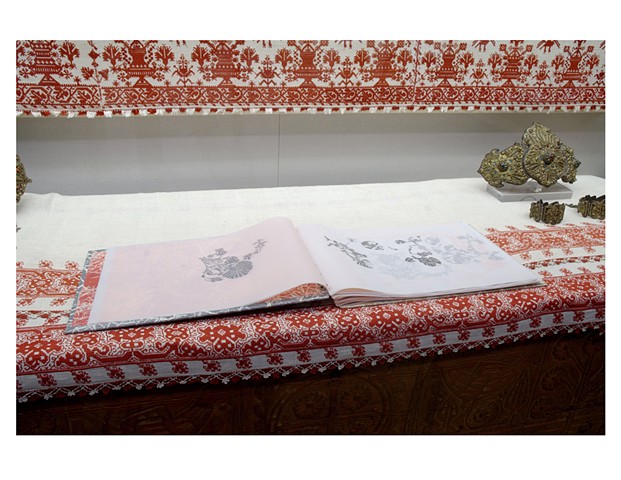a handmade book with images of carnations