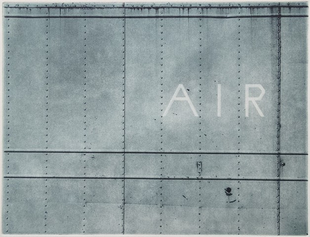 The word AIR on the side of a large metal container in western North Dakota
