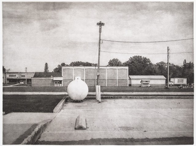 A natural gas tank and a civil defense siren in a small town in the Red River Valley of the North. One-plate polymer photogravure print on pescia paper by John Pearson.