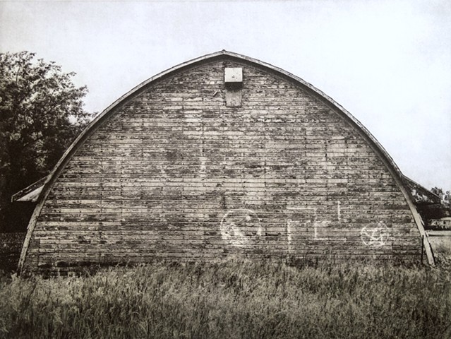 North Dakota barn carrying graffiti symbols: swastika, yin-yan, and pentangle. One-plate polymer photogravure print on pescia paper by John Pearson.