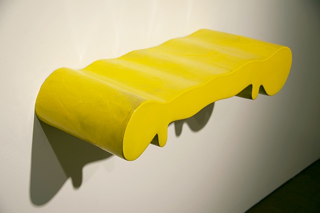 biomorphic ceramic sculpture in yellow by artist Jeff Krueger