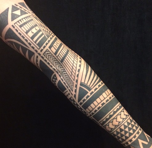 Geometric tribal sleeve tattoo