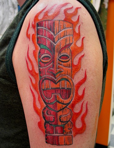 Flaming tiki tattoo