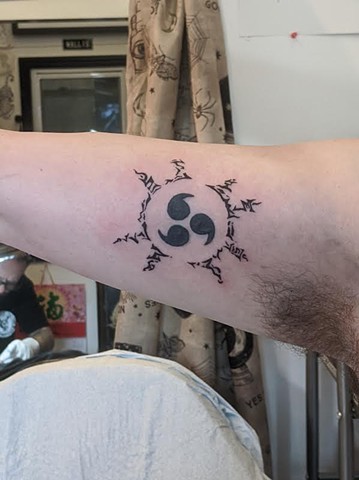 Naruto symbol tattoo