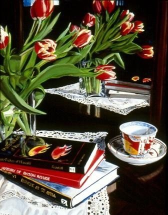Yellow trimmed red tulips bend to table.  Reflection in the mirror shows laced clot, books and Imari cup and saucer.