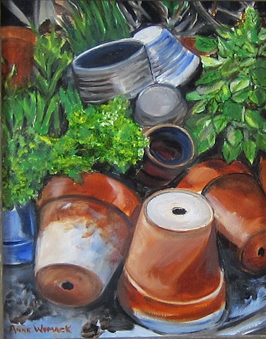 terra cotta clay pots, green folliage, gray and blue pots, scattered or tossed