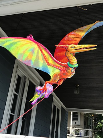 Terry the Pterodactyl, an Addison to the "Puppies are furrrrrever!" Summer 2020 Installation at the corner of Powder House Terrace and Kidder St. Somerville, MA.