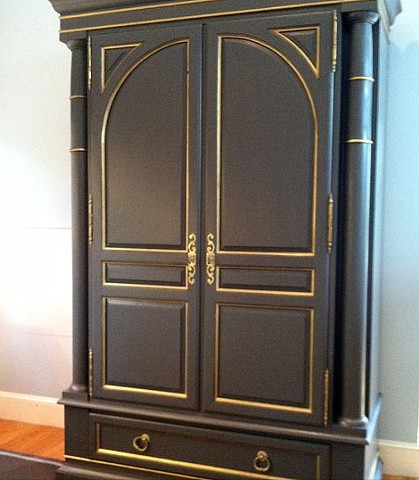 Refinished cabinet in dark gray, with gold accents