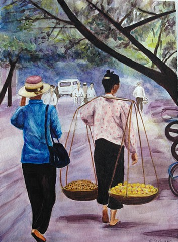 Hanoi, Vietnam, woman carrying baskets, street scene