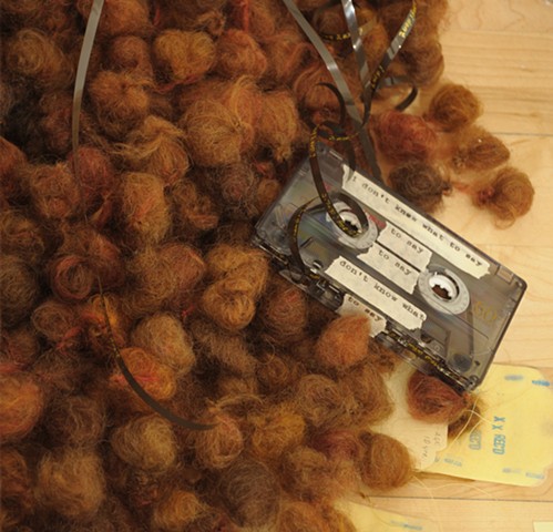 I Don't Know What To Say--detail of audio cassette tape on right side of fiber balls pile