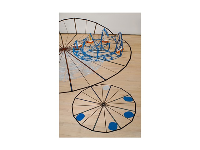 Starwheel Launchpad is a Site Specific Installation by Dianna Frid  Variable dimensions Large circle measures 144 inches in diameter  Tape, cloth, plastic, foil, adhesives, thread, ink, cardboard, metal and plaster  Installed at the Drawing Center, New Y