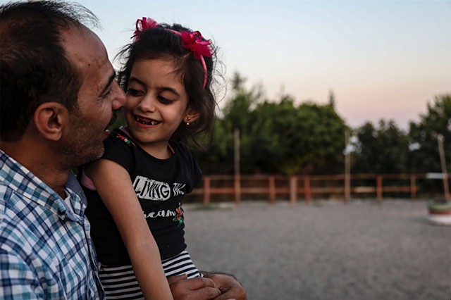 Hala and her father watch the sunset in the Anatolian countryside. 
In order to leave the city of Gaziantep, Abu Mahmoud must apply for permission from the Turkish government or risk immediate deportation to Syria. 