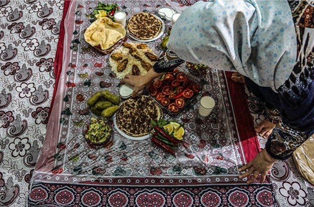 Baheya serves a traditional Syrian dinner in her home.