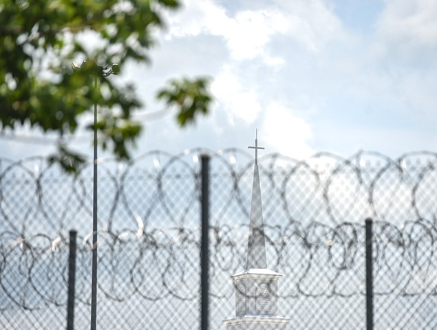 A church steeple peaks over the barbed wire fence following the dedication of the newly constructed chapel at the Mississippi Correctional Institute for Women (MCIW) at Central Mississippi Correctional Facility in Pearl, Miss., Thursday, June 15, 2023.