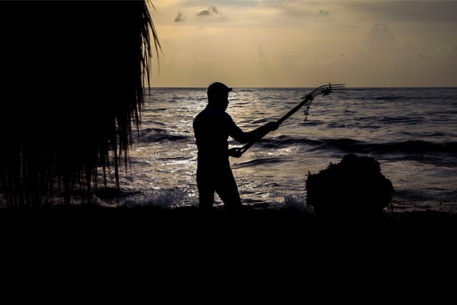 Oscar,* a migrant worker originally from Chiapas, Mexico, rakes away seaweed that has amassed overnight in front of a luxury hotel and resort in Sayulita, Mexico.
He travels to the region seasonally along with the majority of the men who do this work.