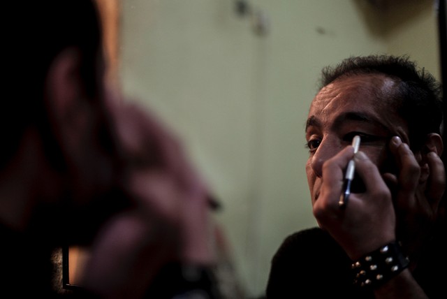 Fire does her makeup and gets ready for a night of work around 3 a.m., Istanbul, Turkey.