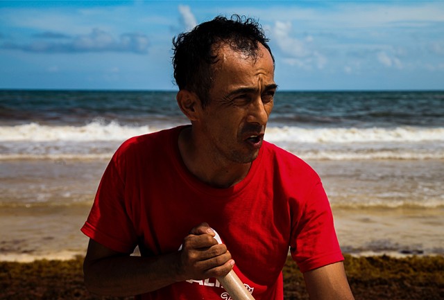 Marc Antonio, one of just a few workers in charge of clearing the mounting seaweed at a small beach front hotel property, sweats in the afternoon sun in Tulum, Mexico.
"There's only three of us, and it gets worse every day. It's like we were never here."
