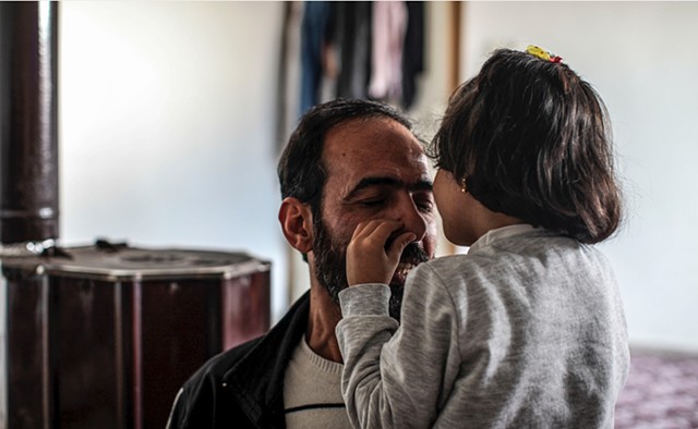 Hala kisses her father's face and says "I love you, I love you, I love you!" in Arabic. 
Although this is the family's sole language, she has begun to learn both Turkish and English and  regularly helps them with translation.