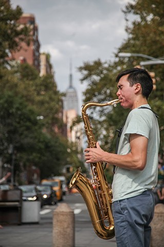 David Yee, a musician new to the city, plays his saxophone in Washington Square Park on September 13, 2015.