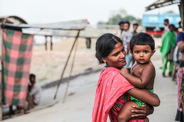 A sex worker who lives with her son in the C & B Ghat sex slum in Faridpur, Bangladesh. Many of the children born in brothels are raised within the community under the care of their mothers and other madams.