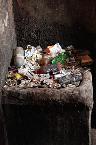 The overflowing trash bins in each hallway of the Rathkhola Brothel in Faridpur, Bangladesh hold used condoms, trash, and other hazardous materials, and are emptied once a week by the building's owner.