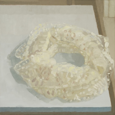 A still Life painting of a piece of lace wrapped in a circle on a table