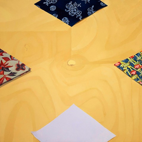 a painting of origami papers on a wooden table viewed from above