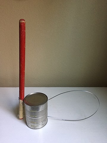 Sculpture with can, wire and stick