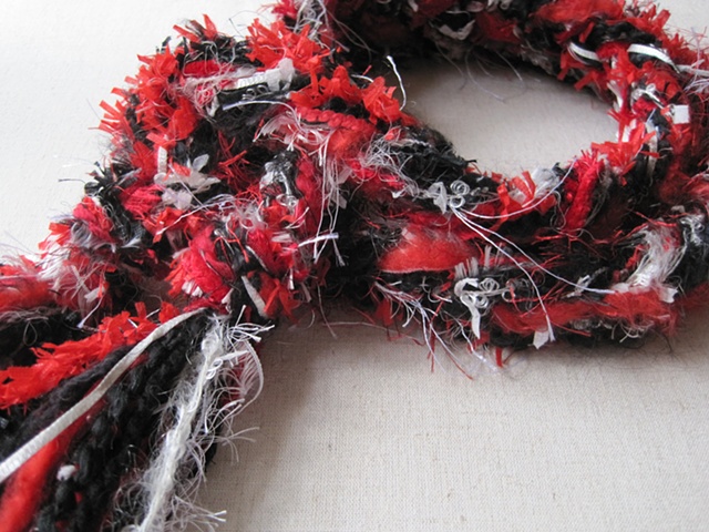 red, black, white braided yarn boa
