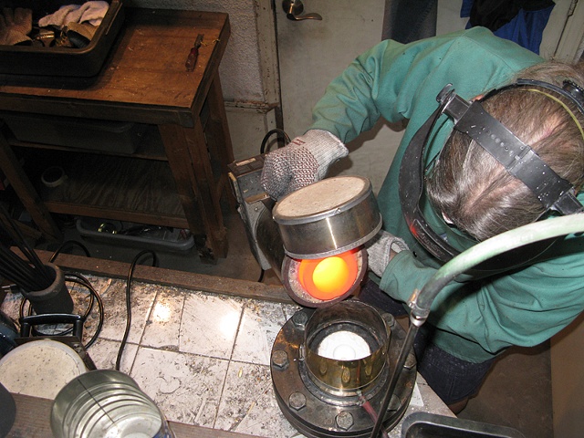 MOLTEN METAL POURED INTO THE FLASK