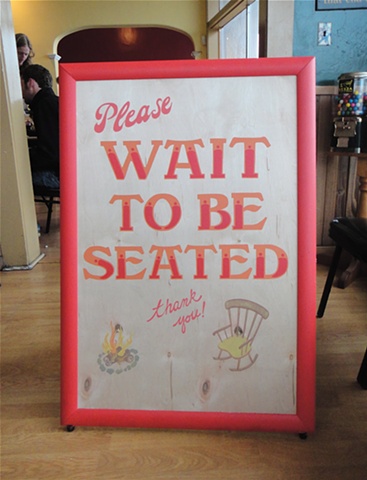 The Pizza Place sandwich board sign