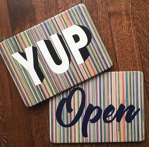 "YUP" / "Open" hand painted signs on recycled skateboards by Iris Skateboards