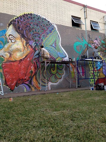 A Janus head Collaboration with street artist Wiley in midtown. Street art mural by Angel Quesada.