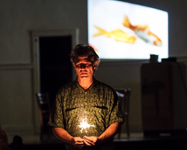 Man with Sparkler and Fishes