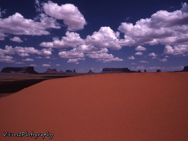 Behind Sand Dune Looking over Monument Valley Utah Award Winning Photograph