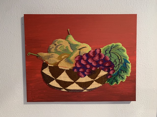 "Autumn Gift" is a shaped, handwoven tapestry of wool, raffia, on cotton. Mounted on canvas. 20 in. x 16 in. 