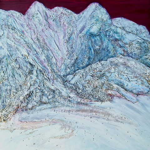 mountain peaks made with collage and gravel against a blood red sky