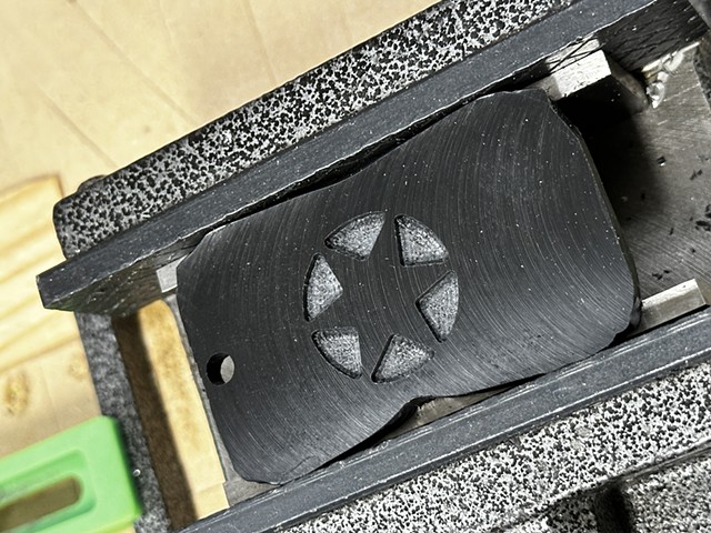 Keychain in vice after engraving