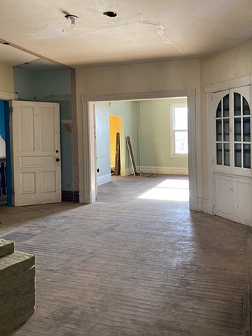 2nd floor. View from kitchen door into front south facing rooms.