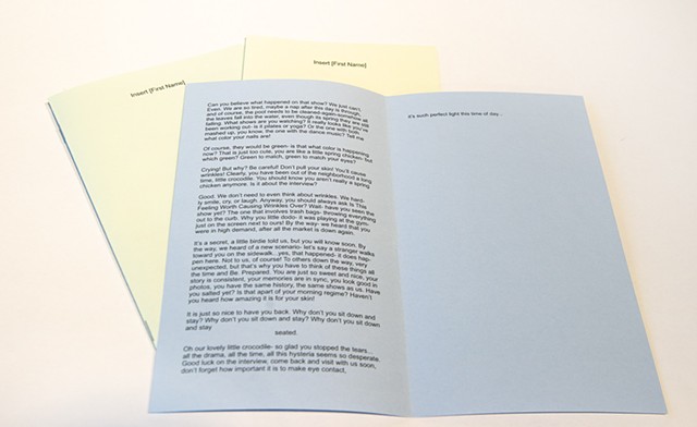 A set of three booklets with an excerpt of the script for each act, open in the image is Act 1’s booklet
