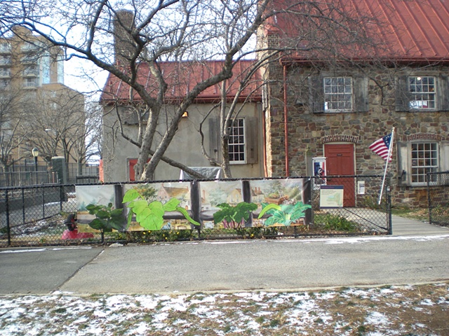 Digitally-printed banners installed on the front fence of the Old Stone House