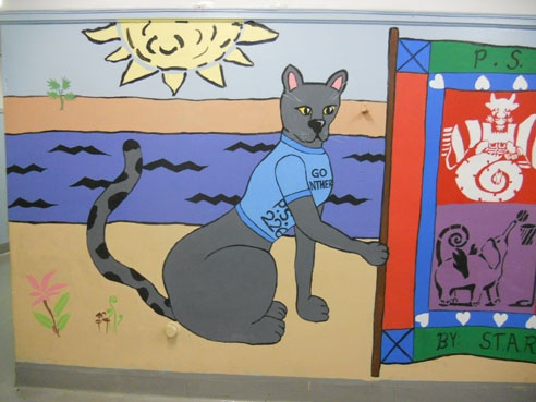 Detail, panther mascot holding flag