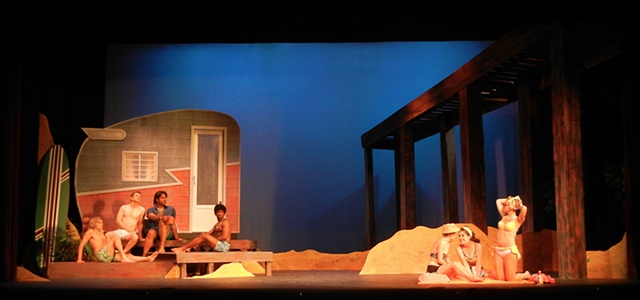 Set Design for Psycho Beach Party with Shasta Trailer, Pier, Sand Dunes and actors