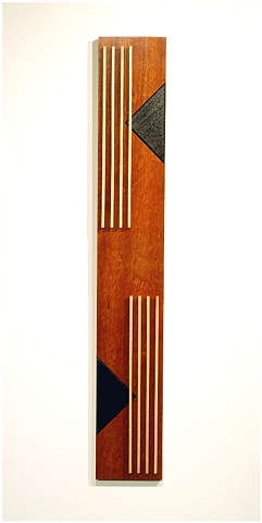 A wooden sculptural wall hanging of Jatoba, ebonized Walnut, Maple and metal