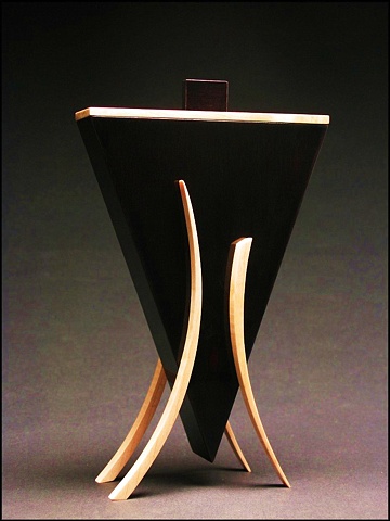 Dark Vessel is a unique sculptural wooden vessel of Maple, ebonized Walnut.