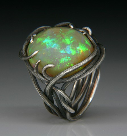 Custom silver hand fabrincated ring with Ethiopian Opal