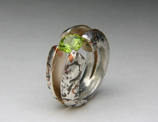 Cross-hairs, tension setting, peridot, copper, silver, Jewels Curnow